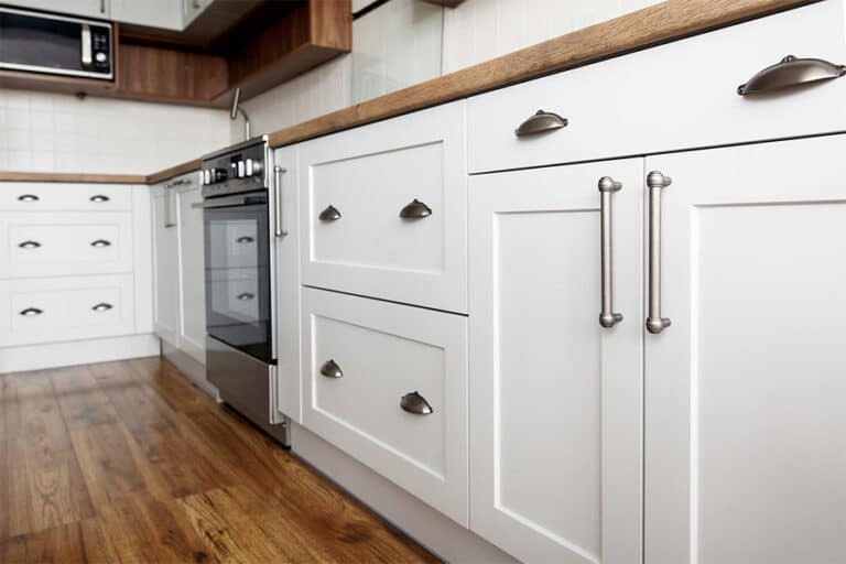 White cabinets with new brushed metal handles