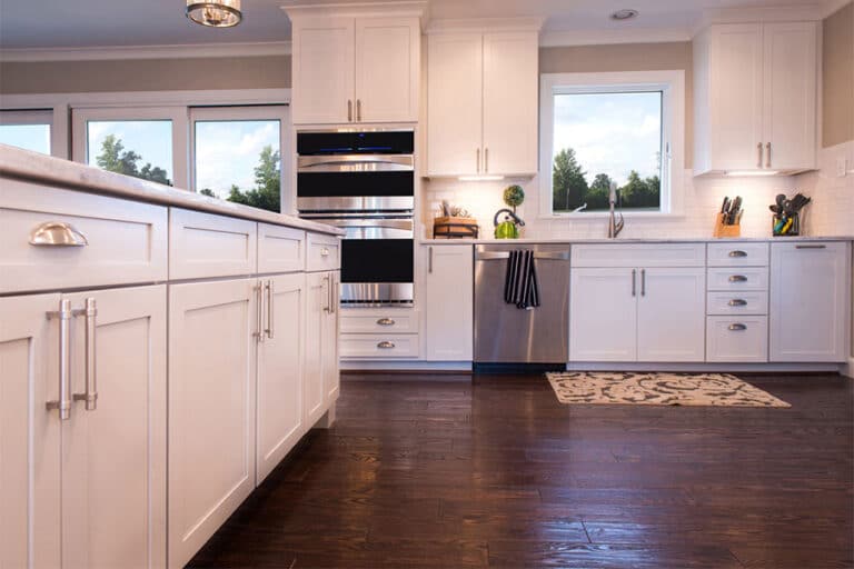 Kitchen with refinished white cabinets and stainless steel appliances